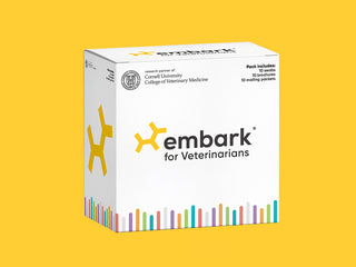 White Embark for Veterinarians dog DNA test pack box, shown at an angle on a yellow background.