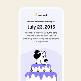 Embark Dog Age Test app screen showing estimated birthday with an illustrated dog sitting atop a birthday cake